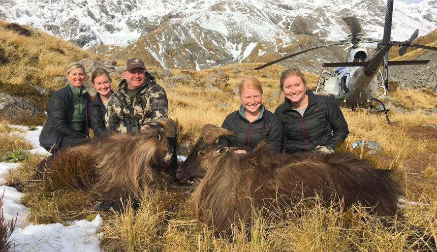 Family enjoying a hunting trip into the Southern Alps by Helicopter