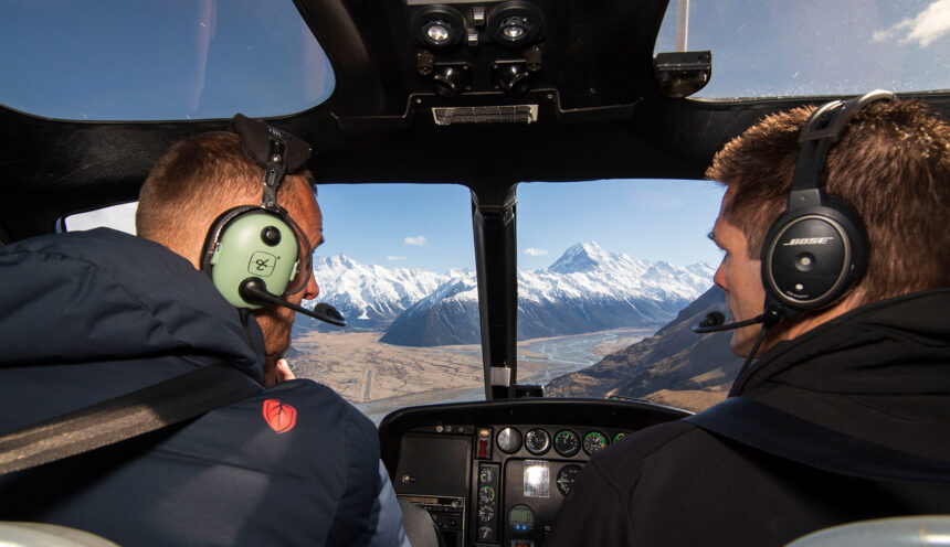 Pilot and passenger flying through the southern alps
