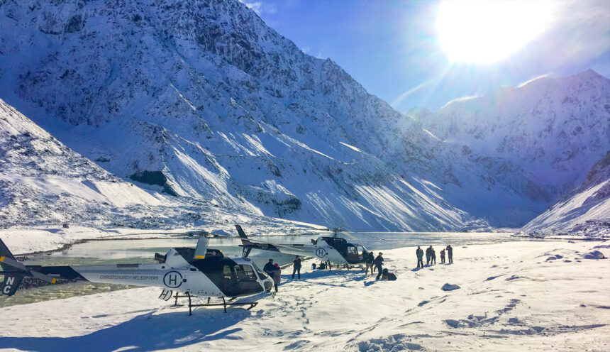 Helicopters parked up next to a Glacier lake